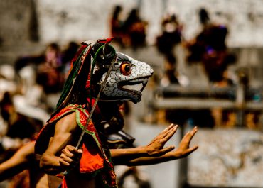 person-wearing-traditional-mask-dancing-738926